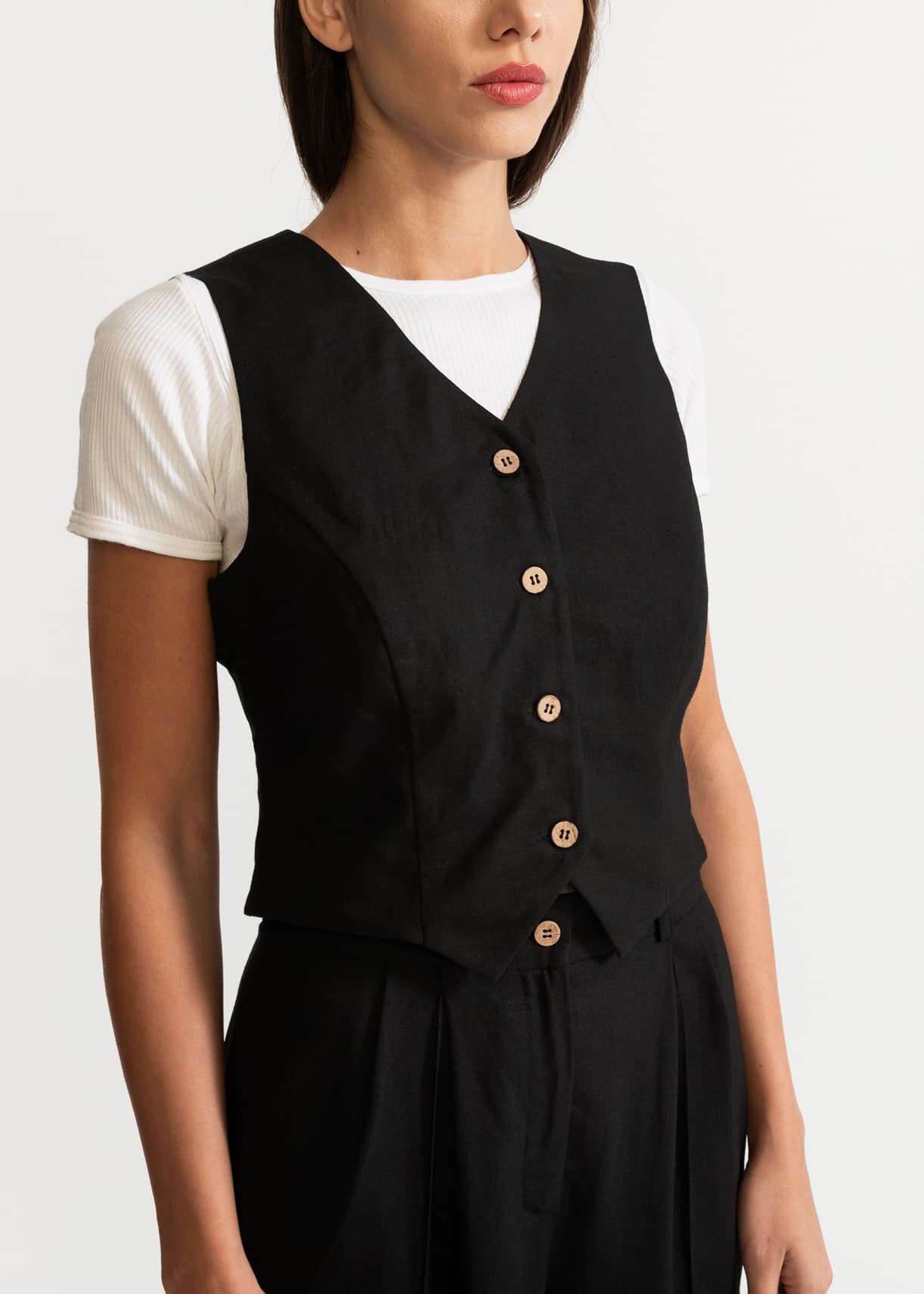 Black linen waistcoat organic button detail close up